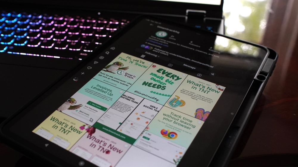 Time 'N Track Instagram feed with illustrated social posts on a tablet