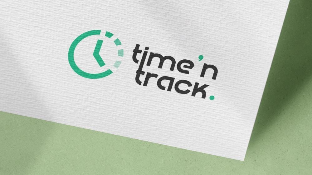 Time 'N Track clock logo printed on textured paper